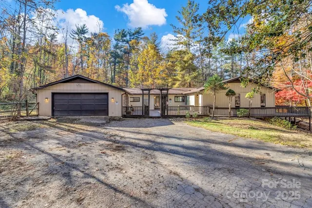 a view of backyard with wooden floor and fence
