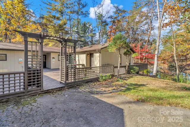 a balcony with wooden floor and fence