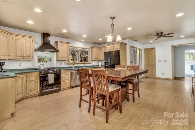 a kitchen with a stove sink and refrigerator