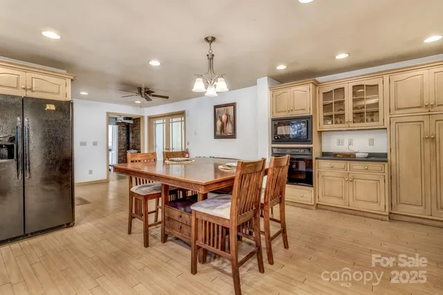 a kitchen with stainless steel appliances granite countertop a stove and a microwave