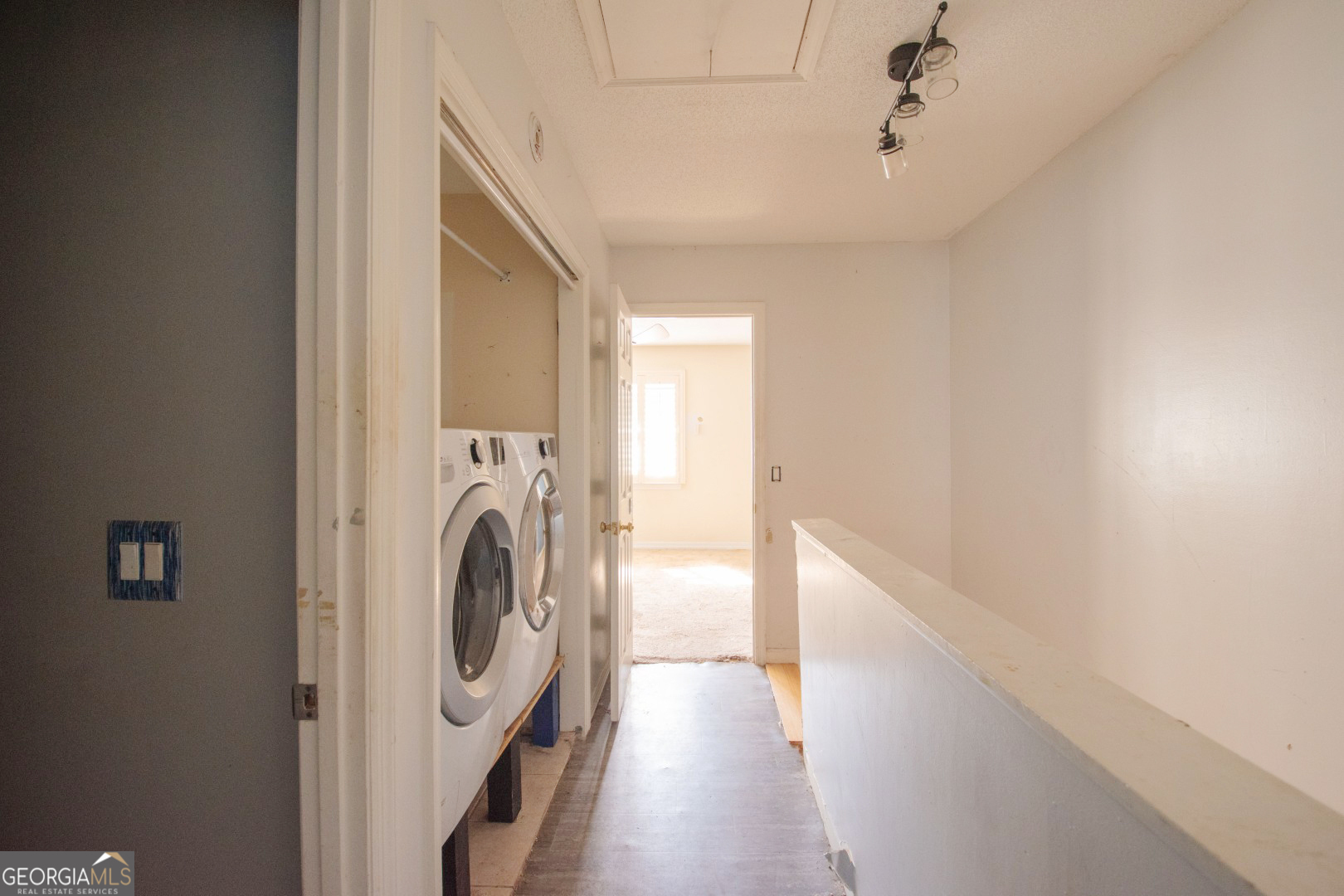 113 Inlet Reach Circle St. Marys, GA 31558 - Photo 14 of 18 a view of a hallway with washer and dryer