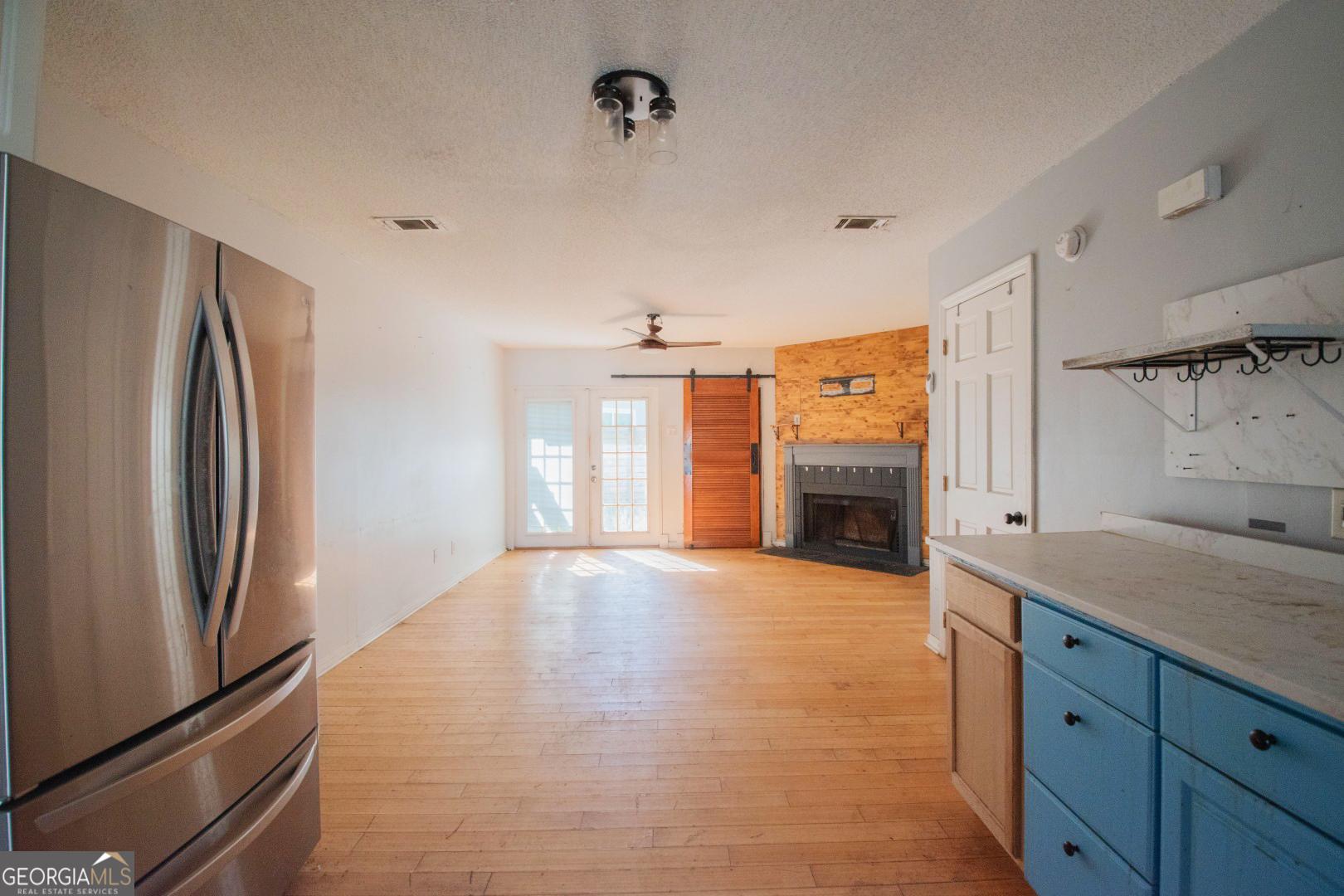 113 Inlet Reach Circle St. Marys, GA 31558 - Photo 2 of 18 a view of an empty room with a fireplace and a window