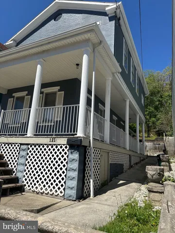 a view of a house with wooden deck