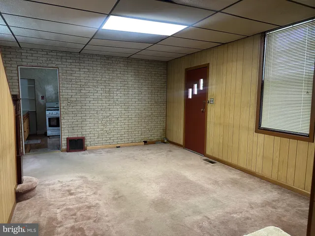 a view of empty room with windows