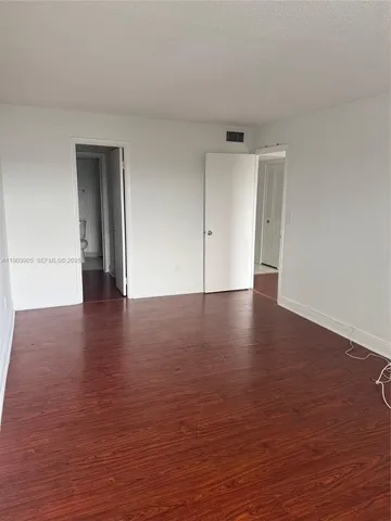 a view of a livingroom with wooden floor
