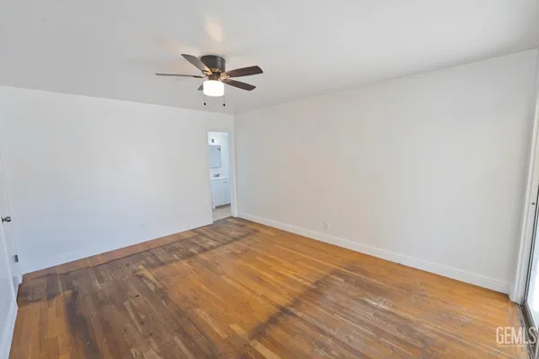a view of a big room with wooden floor in closet