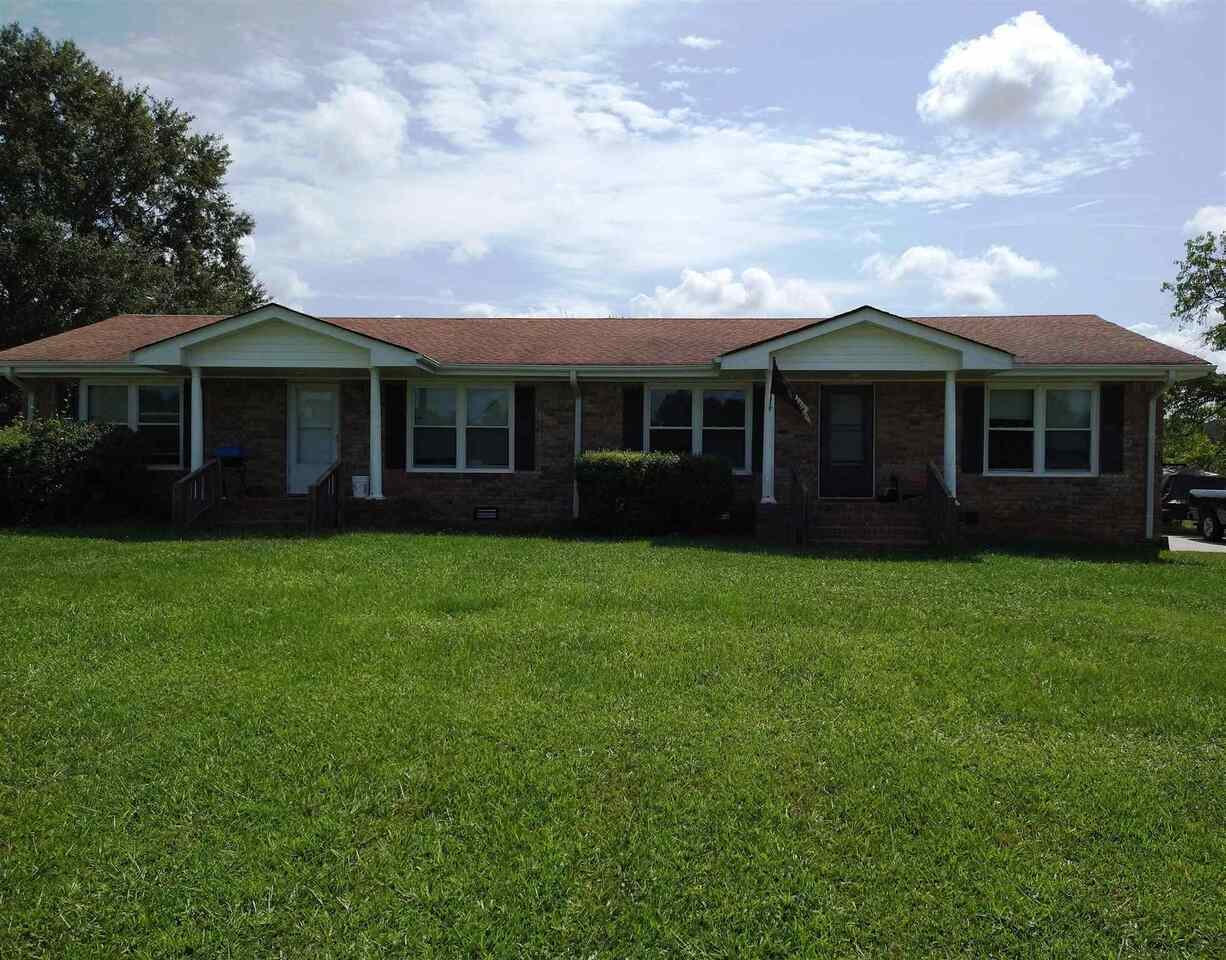 703 North Van Wert Road Villa Rica, GA 30180 - Photo 1 of 1 a view of a house with a garden and plants