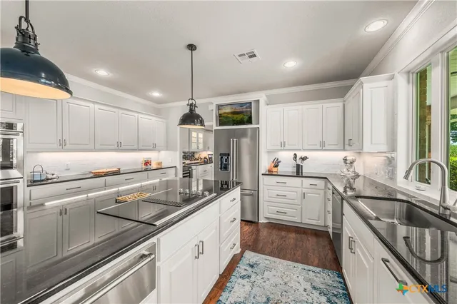 a bedroom with a bed a bookshelf and a dresser