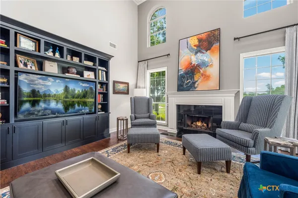 a bedroom with a bed a couch and a dresser