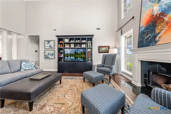 a living room with furniture and a window