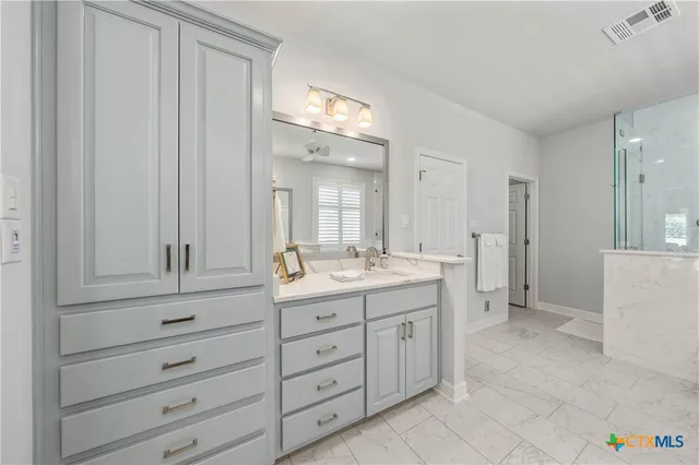 a bed room with a bed and a chair