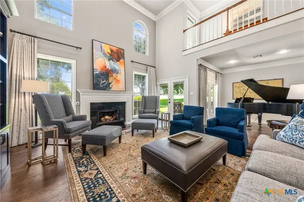a kitchen with stainless steel appliances a stove a sink a refrigerator and cabinets