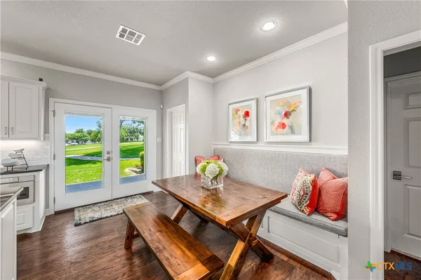 a view of a livingroom with furniture and wooden floor
