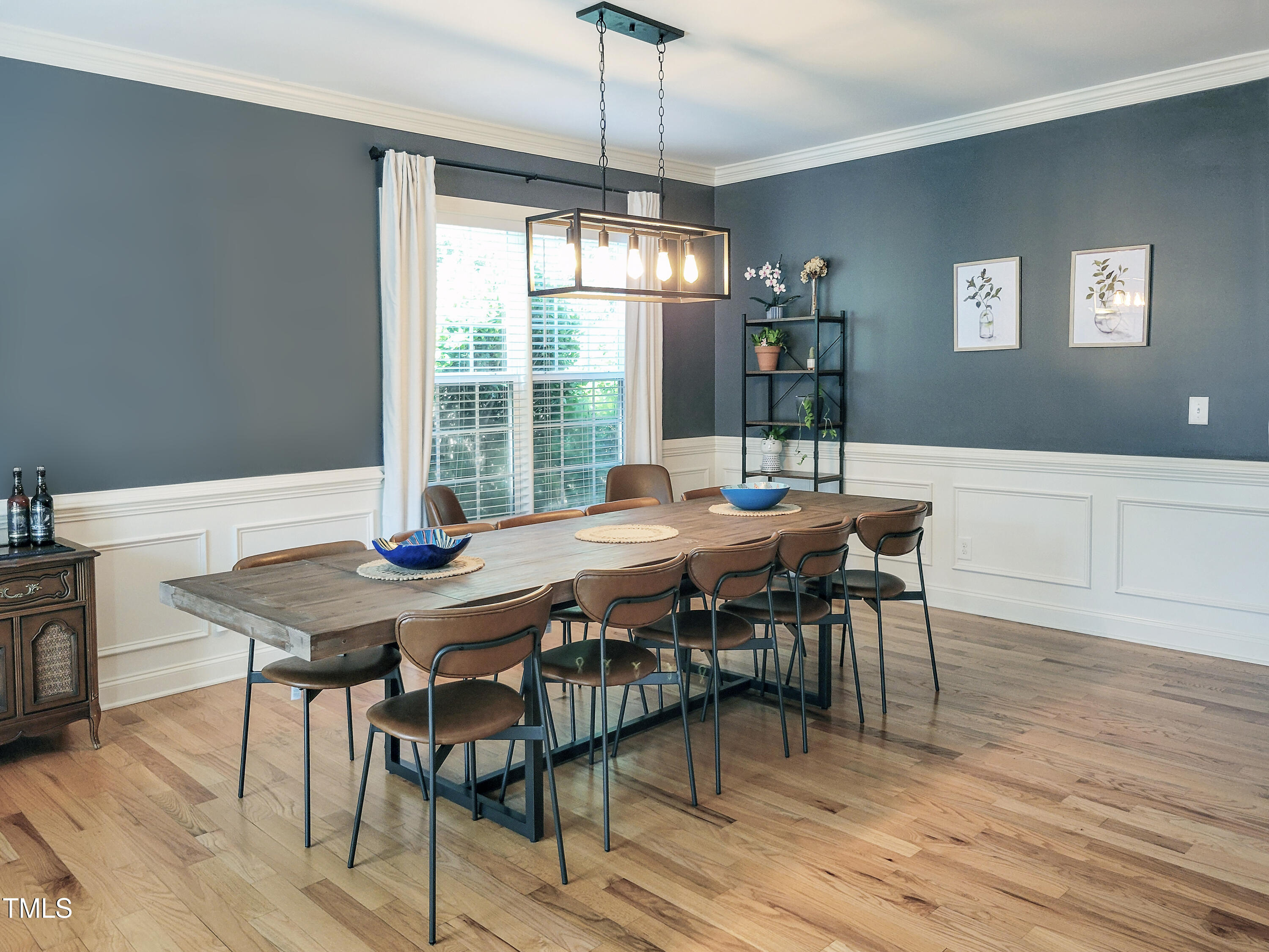 7502 Hedfield Way Durham, NC 27713 - Photo 11 of 28 a view of a dining room with furniture window and wooden floor