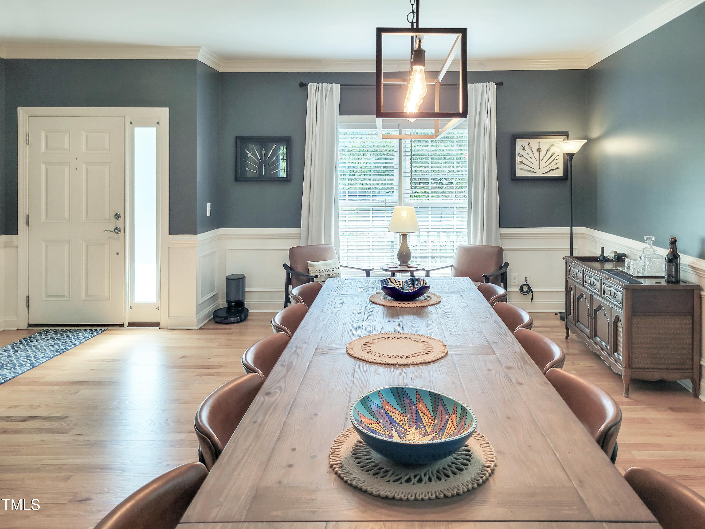 7502 Hedfield Way Durham, NC 27713 - Photo 12 of 28 a table and chairs in a living room