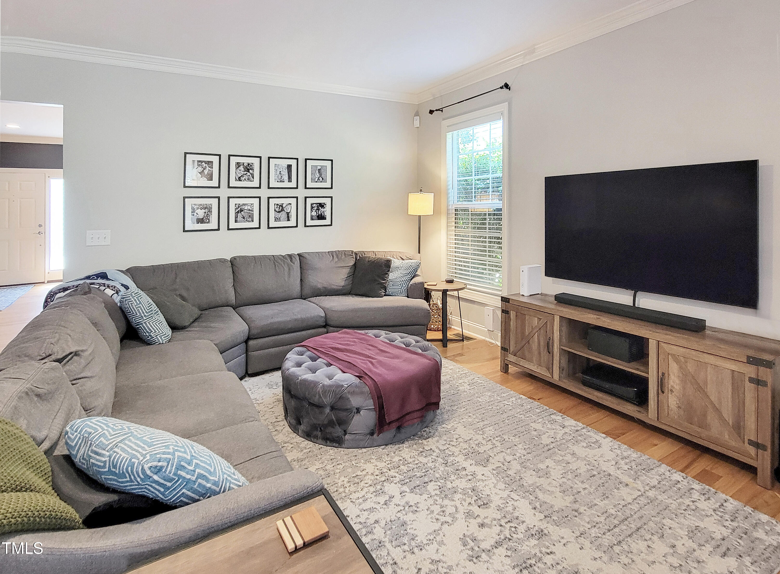 7502 Hedfield Way Durham, NC 27713 - Photo 13 of 28 a living room with furniture and a flat screen tv
