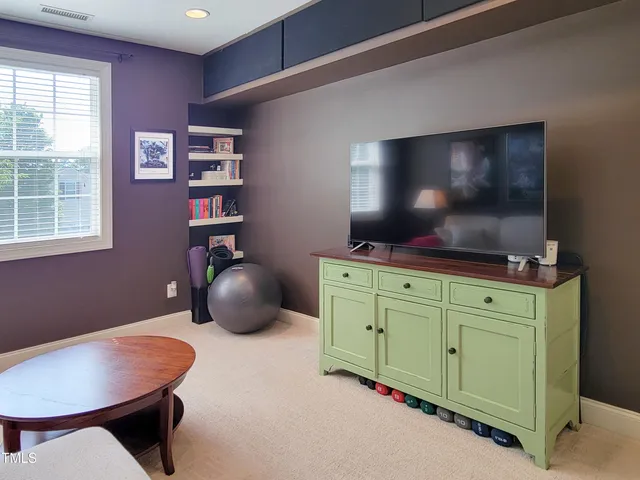 a room with furniture and flat screen tv