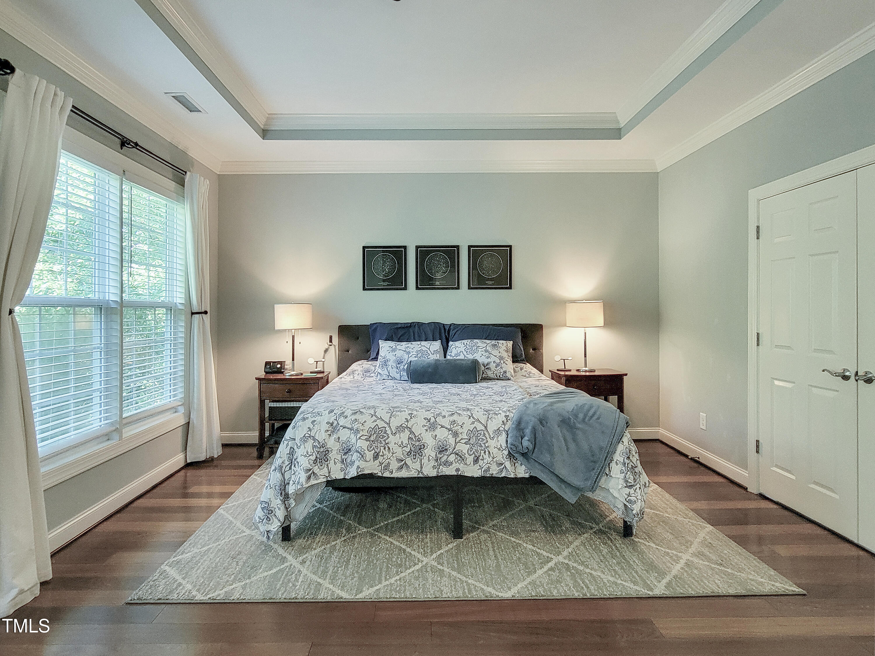 7502 Hedfield Way Durham, NC 27713 - Photo 18 of 28 a bedroom with a bed and window
