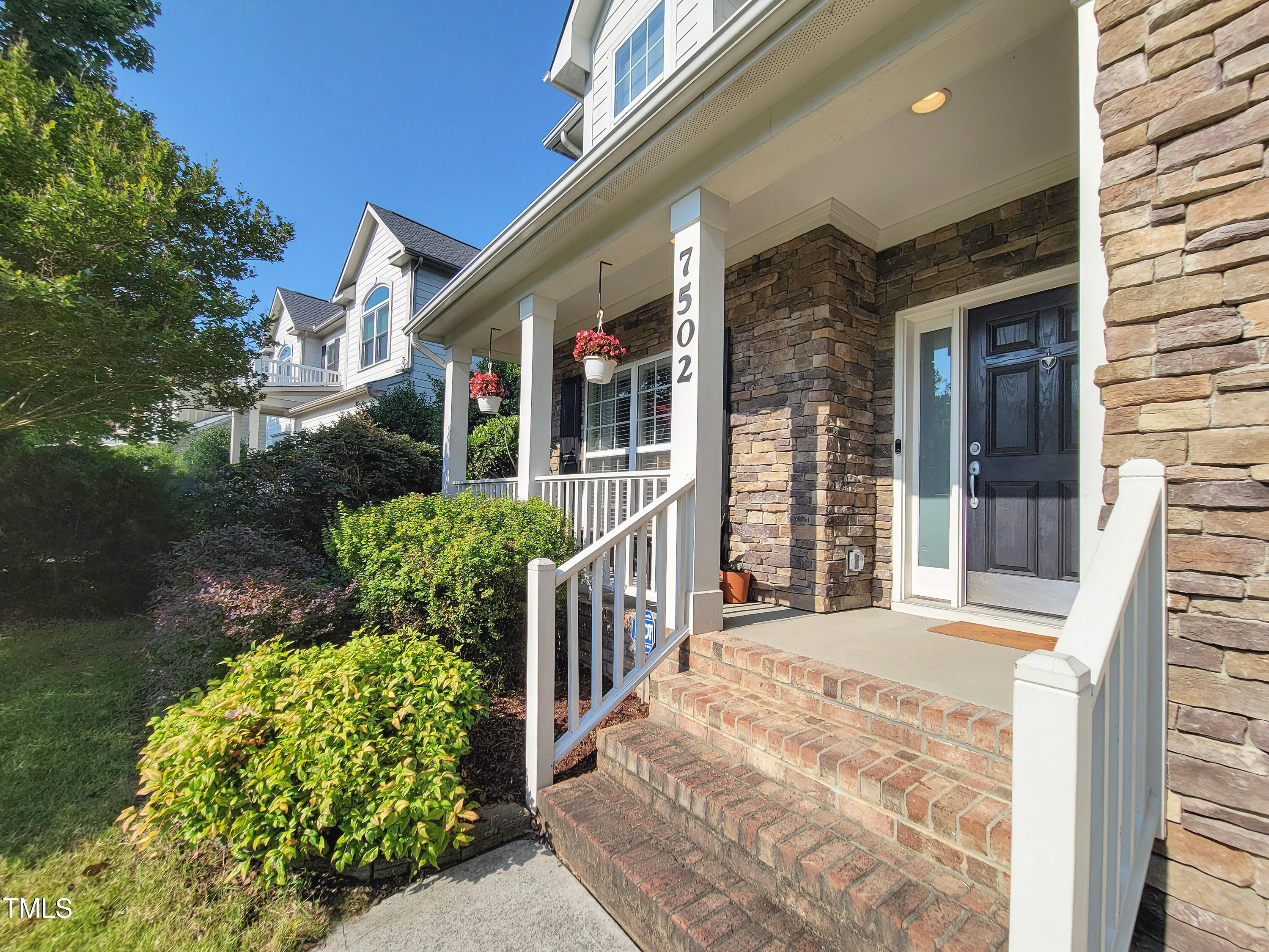7502 Hedfield Way Durham, NC 27713 - Photo 2 of 28 a front view of a house with a porch