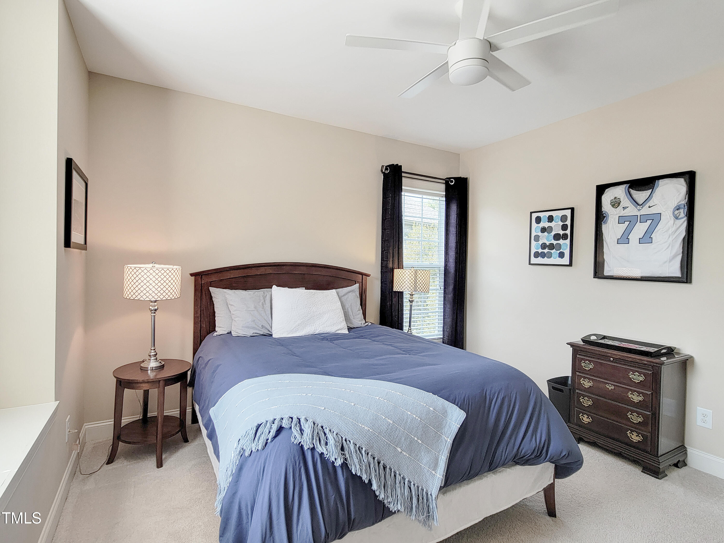 7502 Hedfield Way Durham, NC 27713 - Photo 25 of 28 a bedroom with a bed and a night stand