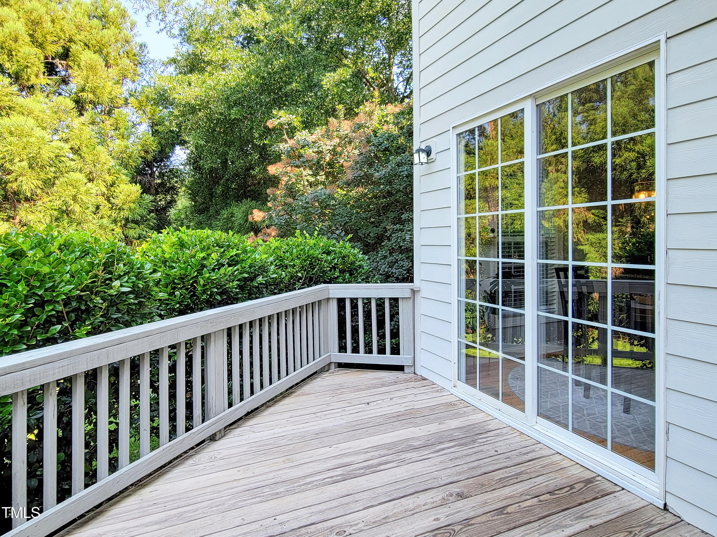 7502 Hedfield Way Durham, NC 27713 - Photo 27 of 28 a view of balcony with wooden floor and fence