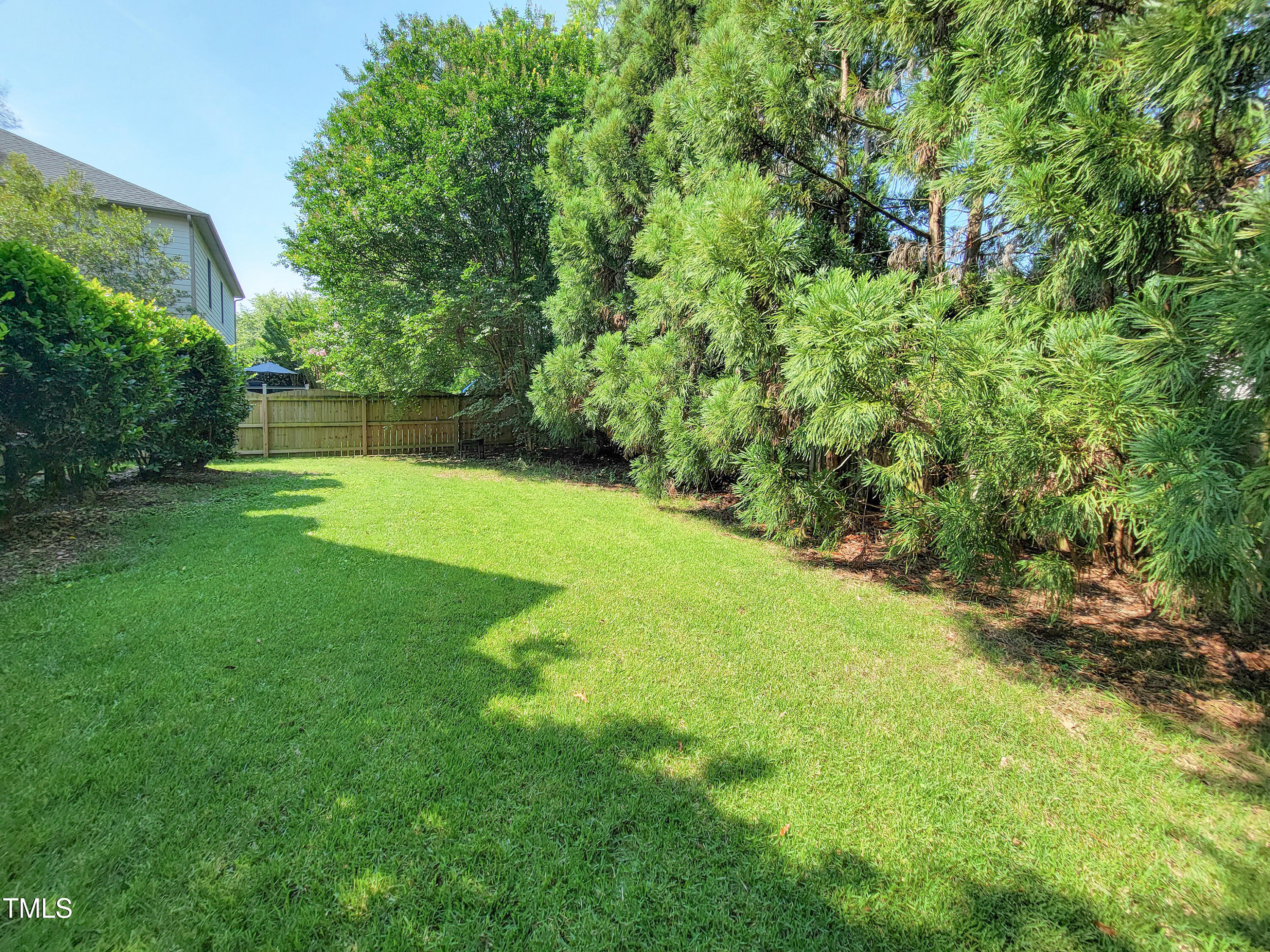 7502 Hedfield Way Durham, NC 27713 - Photo 28 of 28 a view of a backyard with a garden