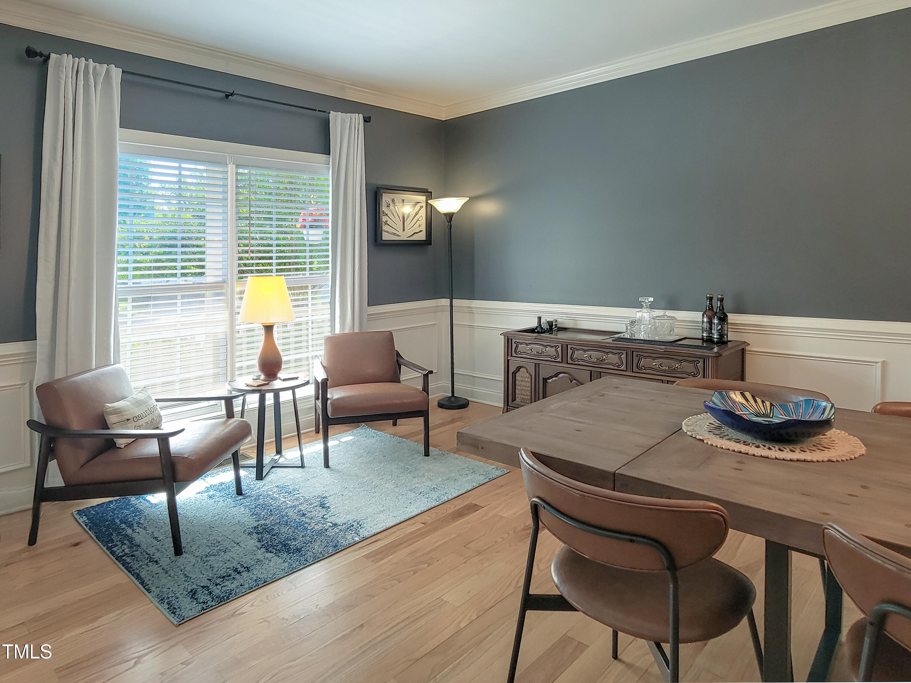 7502 Hedfield Way Durham, NC 27713 - Photo 3 of 28 a living room with furniture and a table