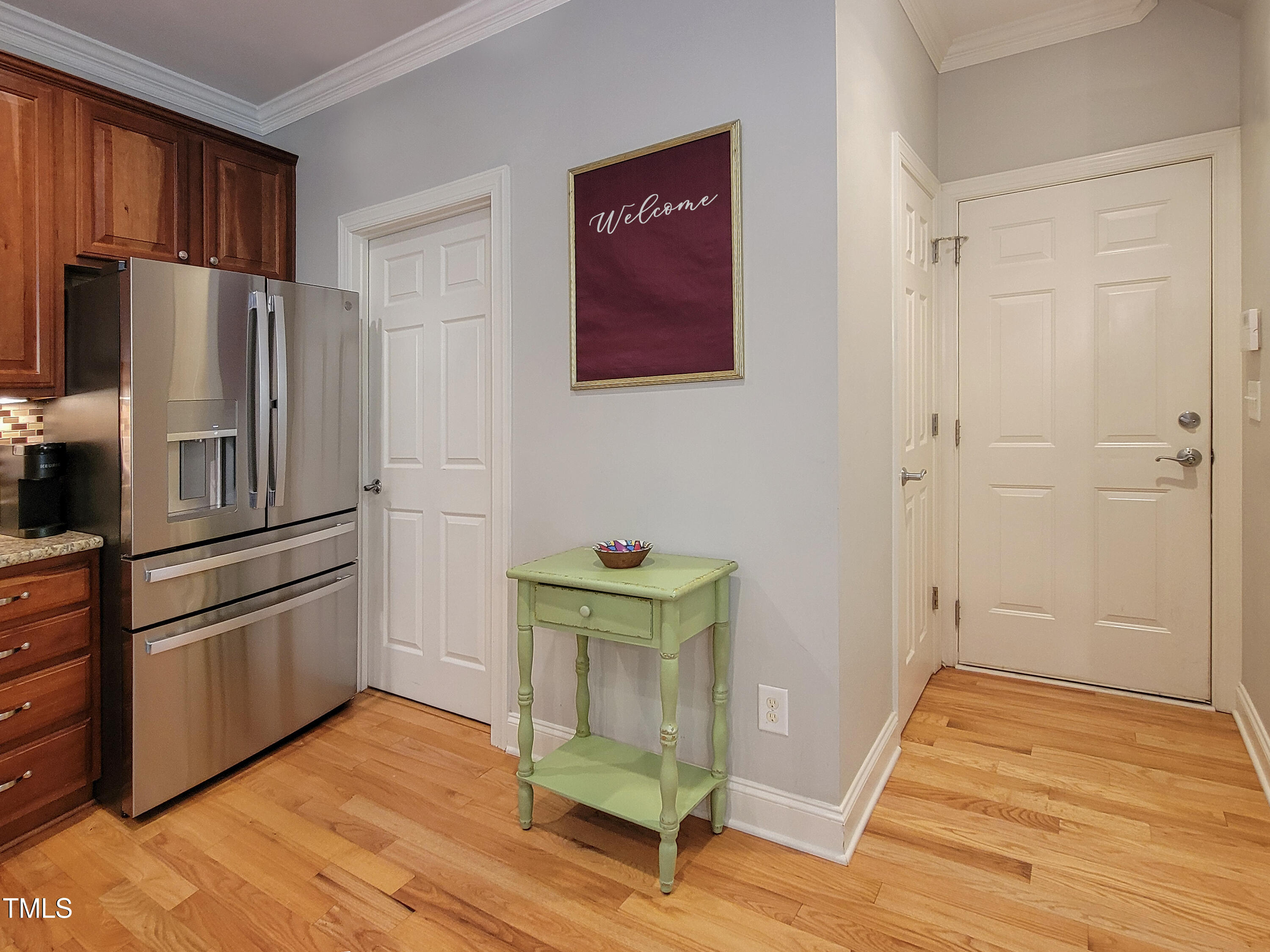 7502 Hedfield Way Durham, NC 27713 - Photo 7 of 28 a kitchen with stainless steel appliances granite countertop a refrigerator and a stove