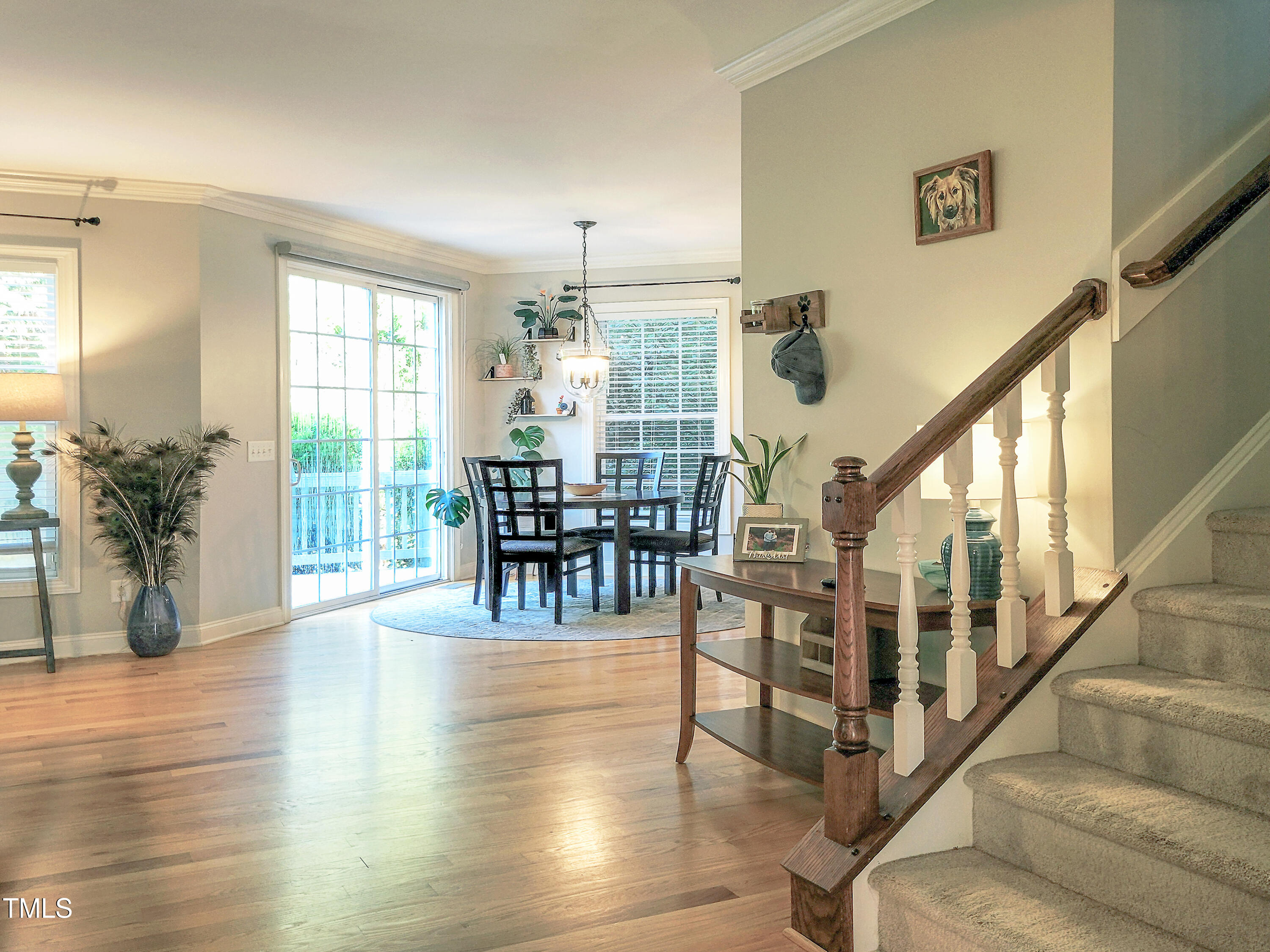 7502 Hedfield Way Durham, NC 27713 - Photo 9 of 28 a view of dining room with furniture and wooden floor