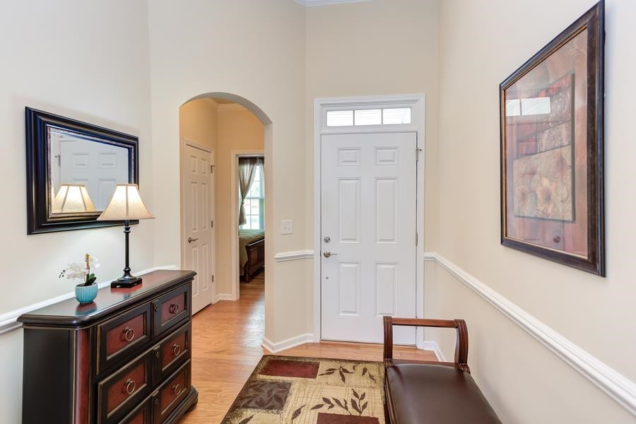Guests are greeted with a high ceiling and gleaming hardwood floors. No carpet in the home! Foyer