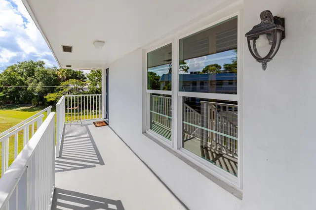 a view of entryway with wooden floor and fan