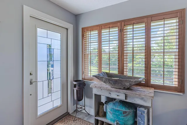 a view of a livingroom with furniture and window