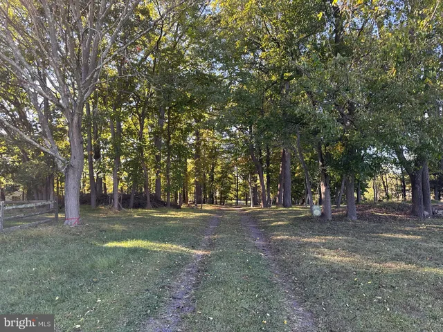 a bedroom with furniture and a large window