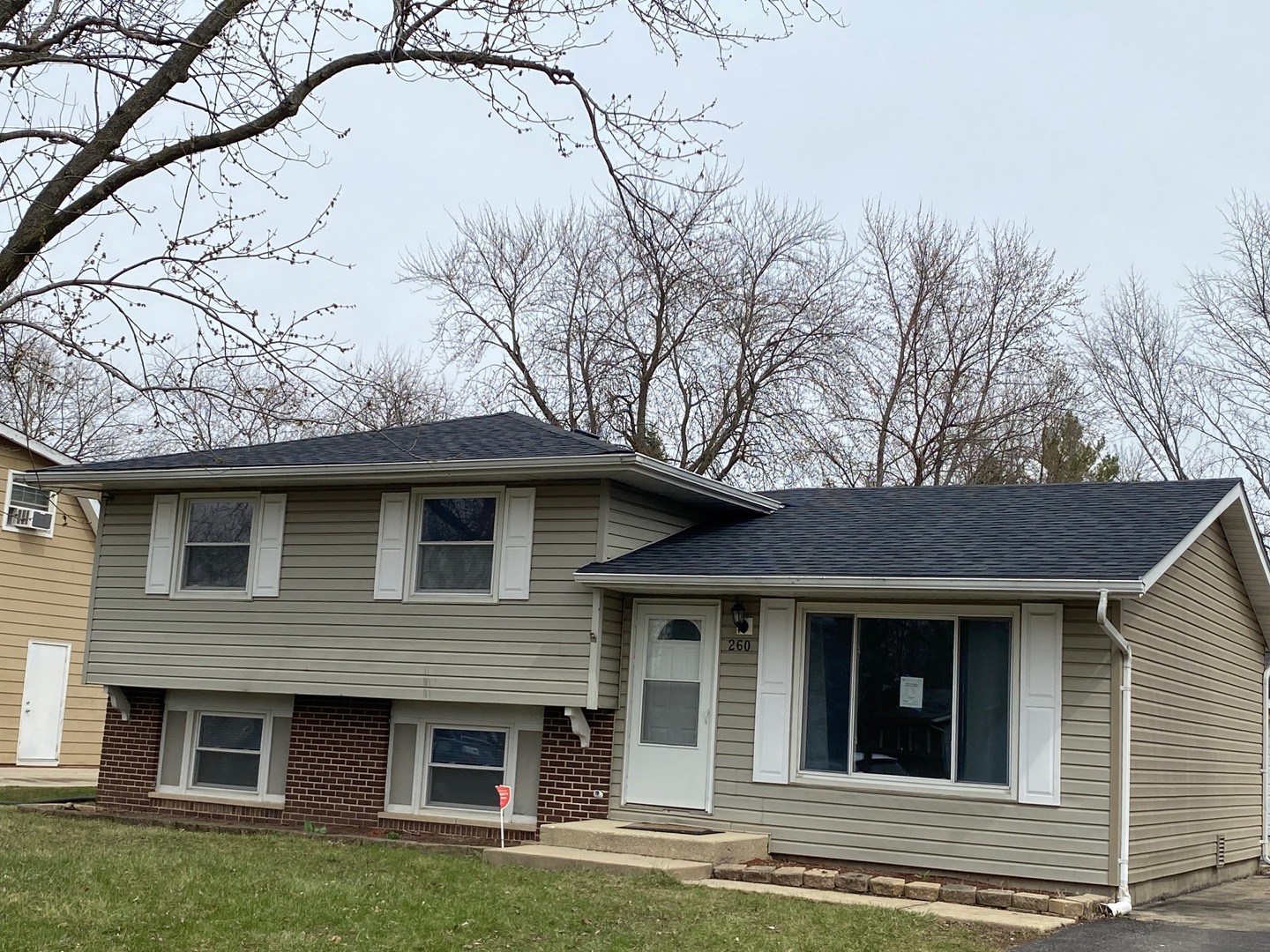 260 Plainview Drive Bolingbrook, IL 60440 - Photo 1 of 1 a front view of a house with a garden and yard