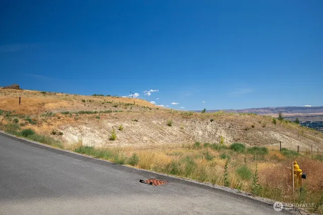 a view of a large body of water with a building in the background
