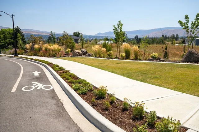 a view of a swimming pool with a yard