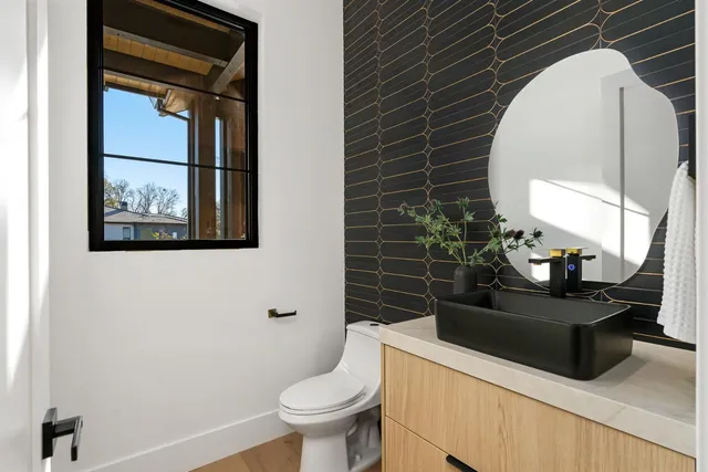 a bathroom with a toilet sink and shower