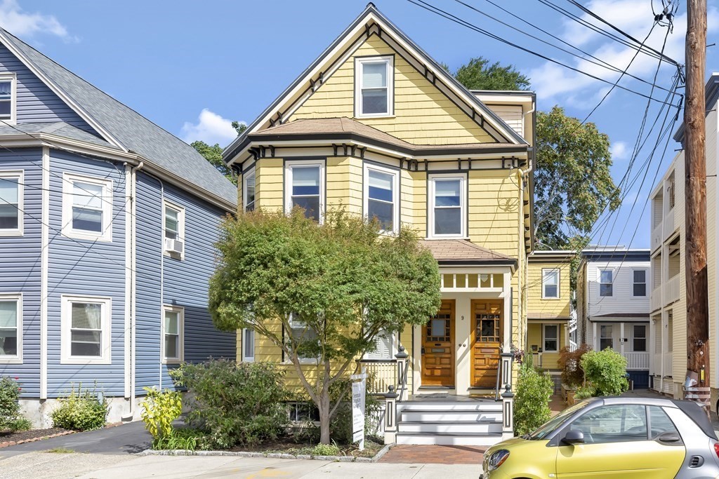 9 Joseph Street, Unit 1 Somerville, MA 02143 - Photo 12 of 17 a front view of residential houses with yard