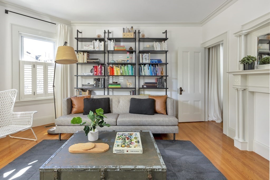 9 Joseph Street, Unit 1 Somerville, MA 02143 - Photo 2 of 17 a living room with furniture and a book shelf