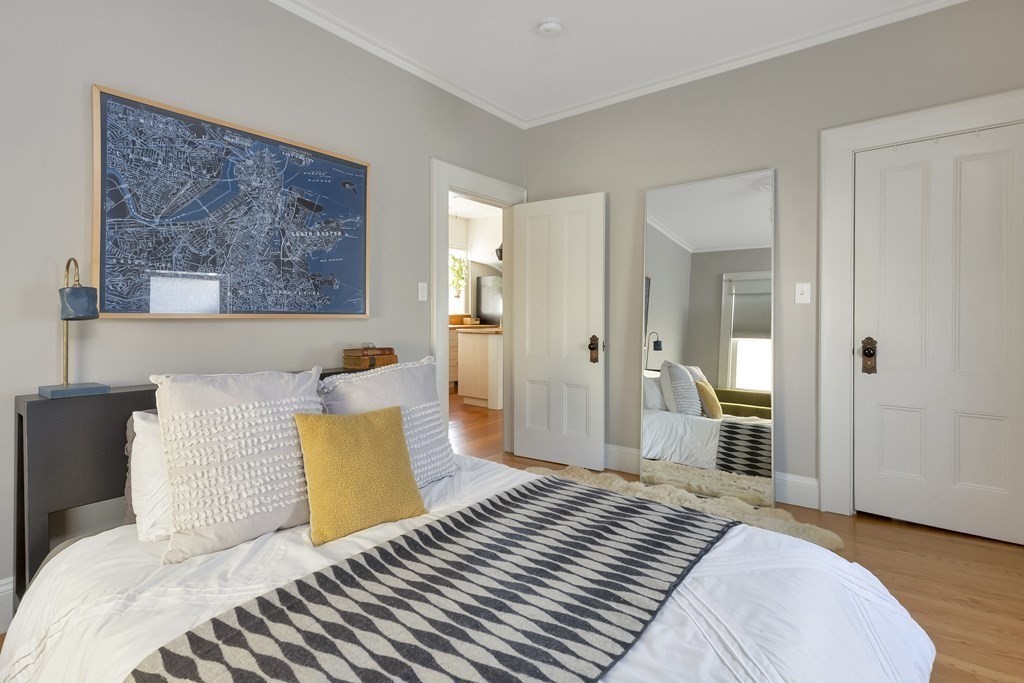 9 Joseph Street, Unit 1 Somerville, MA 02143 - Photo 8 of 17 a bedroom with bed and walk in closet