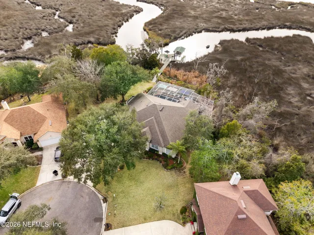 a view of a a dining room with furniture window and wooden floor