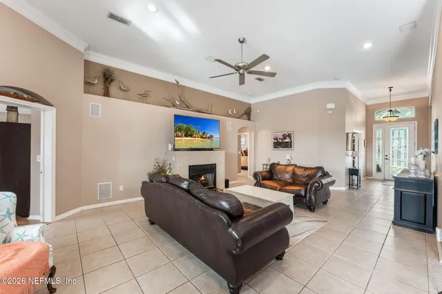 a view of a livingroom with furniture and a ceiling fan