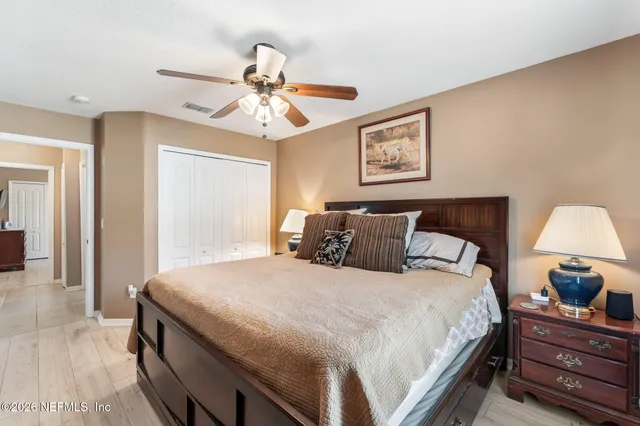 a room with a white wall and a chandelier