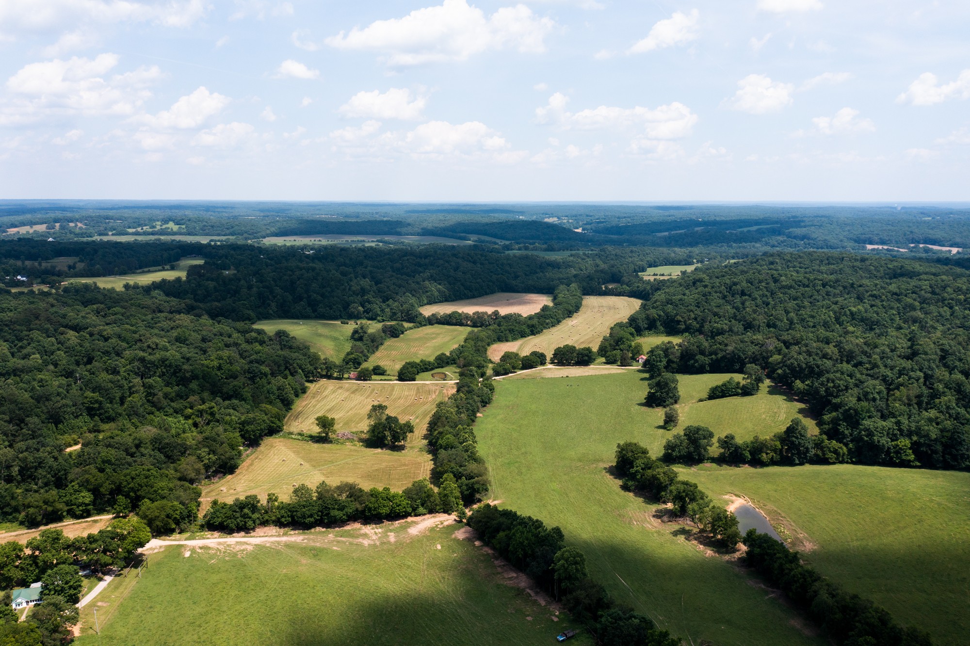 2895 South Possum Hollow Road Nunnelly, TN 37137 - Photo 8 of 25 an aerial view of a house with a garden