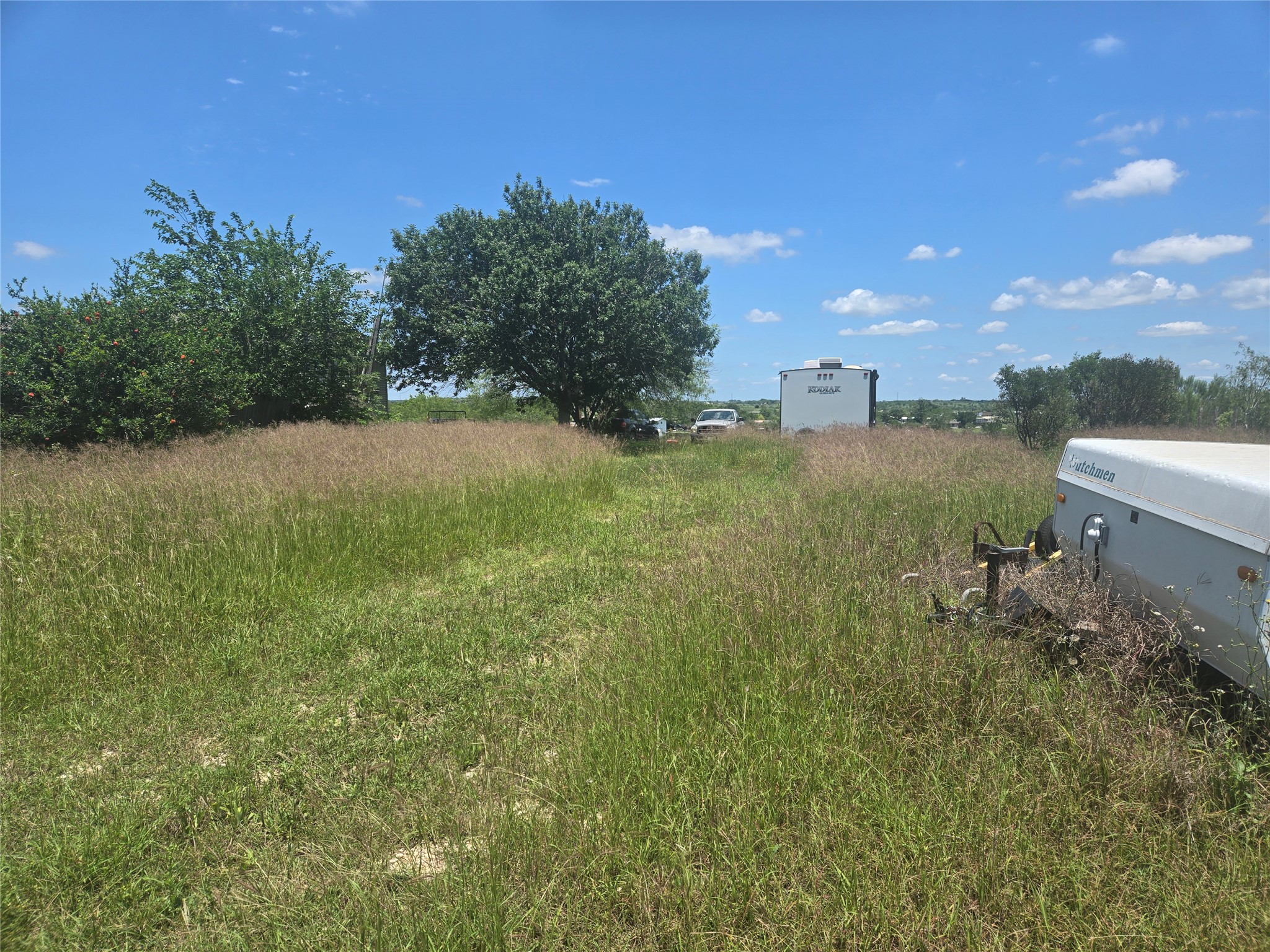 150 Longhorn Loop Kyle, TX 78640 - Photo 11 of 13 a view of a yard with an outdoor space and seating