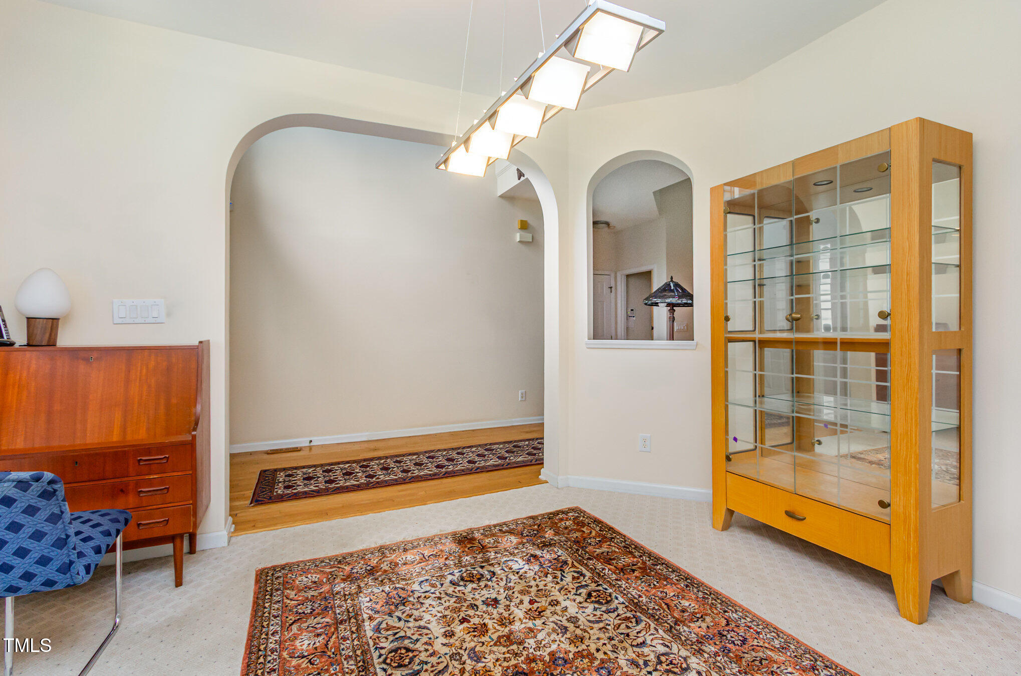 401 Stinhurst Drive Durham, NC 27713 - Photo 14 of 39 a living room with a bed and a couch