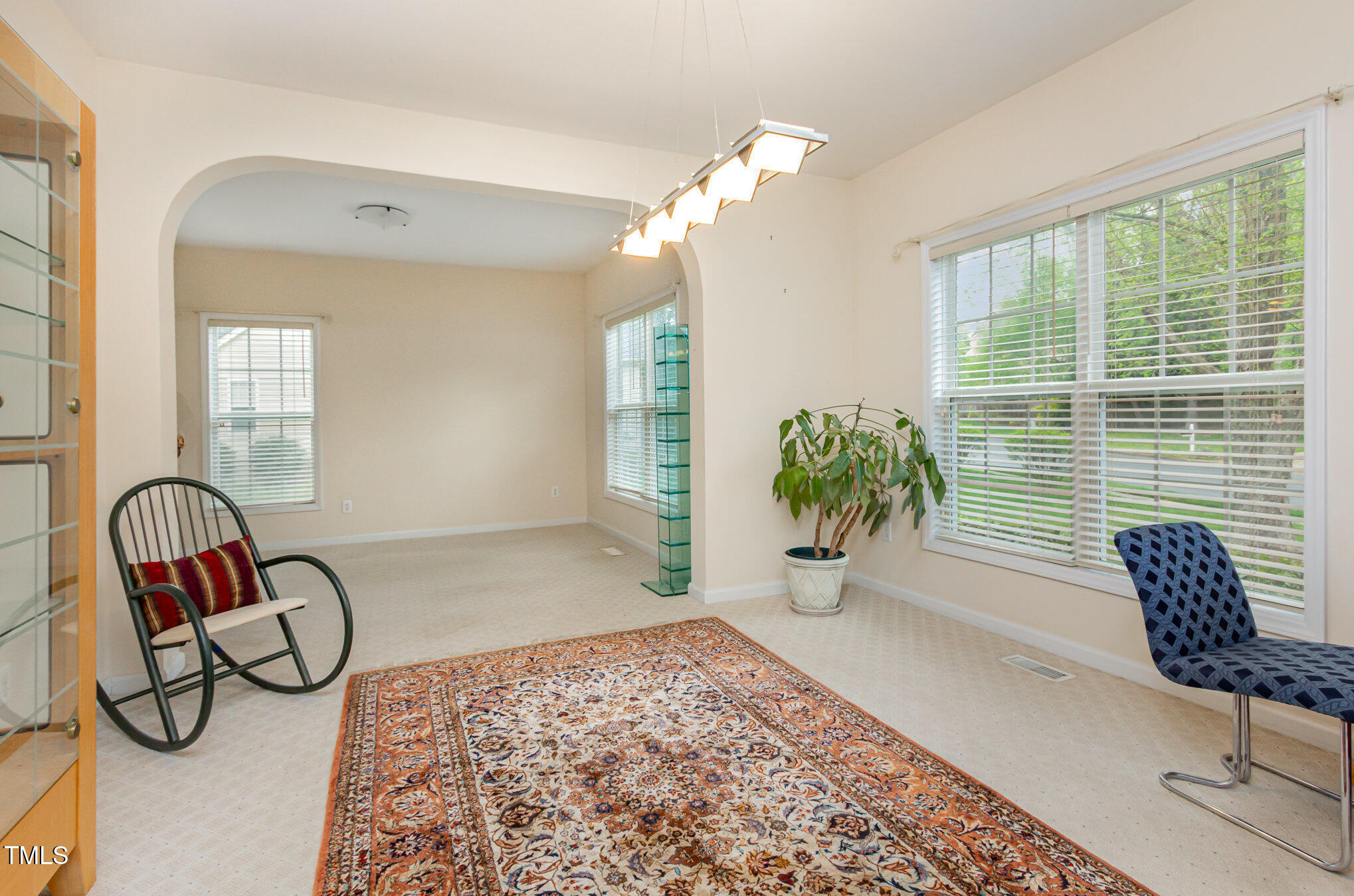 401 Stinhurst Drive Durham, NC 27713 - Photo 15 of 39 a view of living room filled with furniture and a potted plant