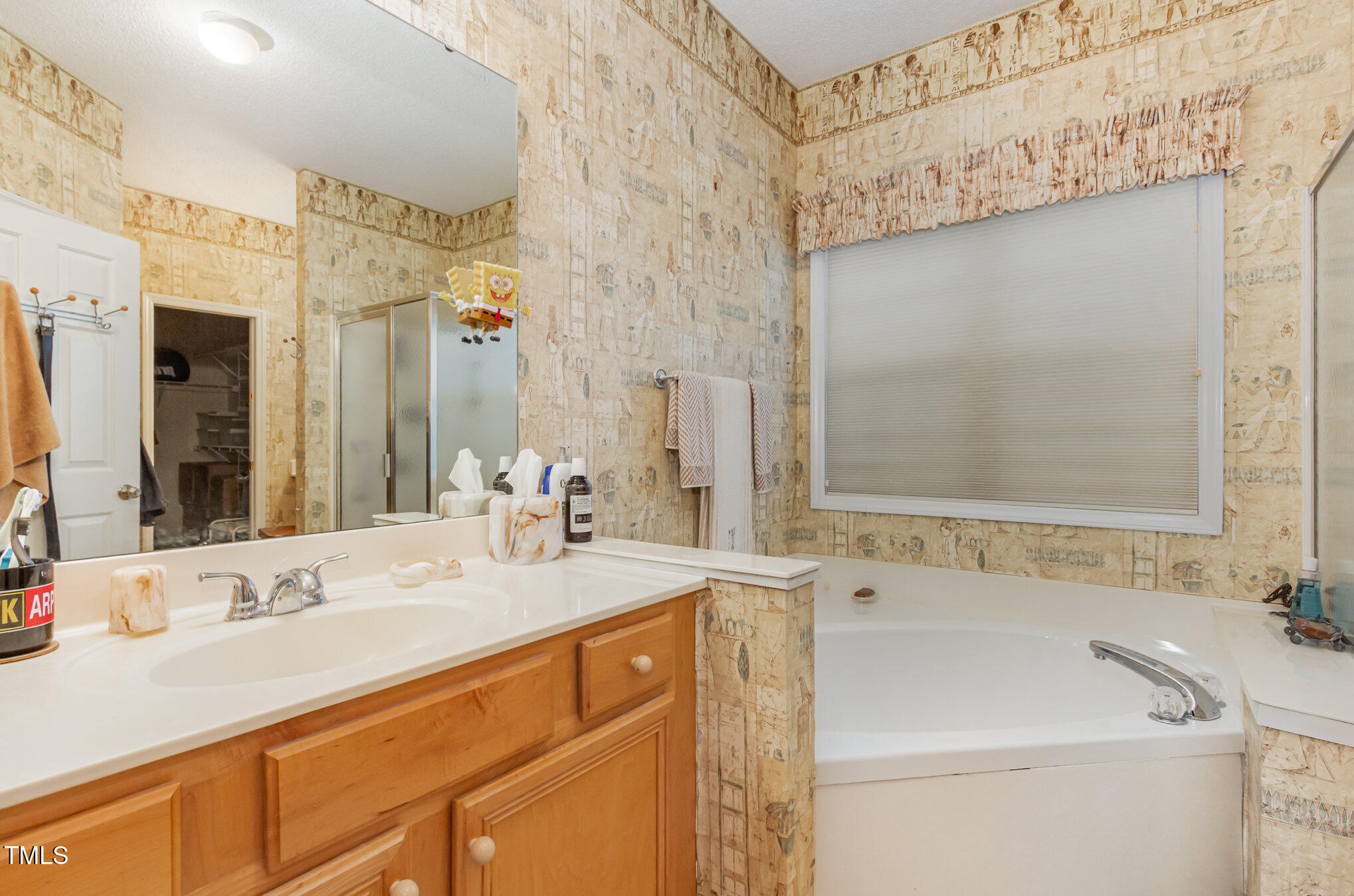 401 Stinhurst Drive Durham, NC 27713 - Photo 18 of 39 a bathroom with a sink and a mirror