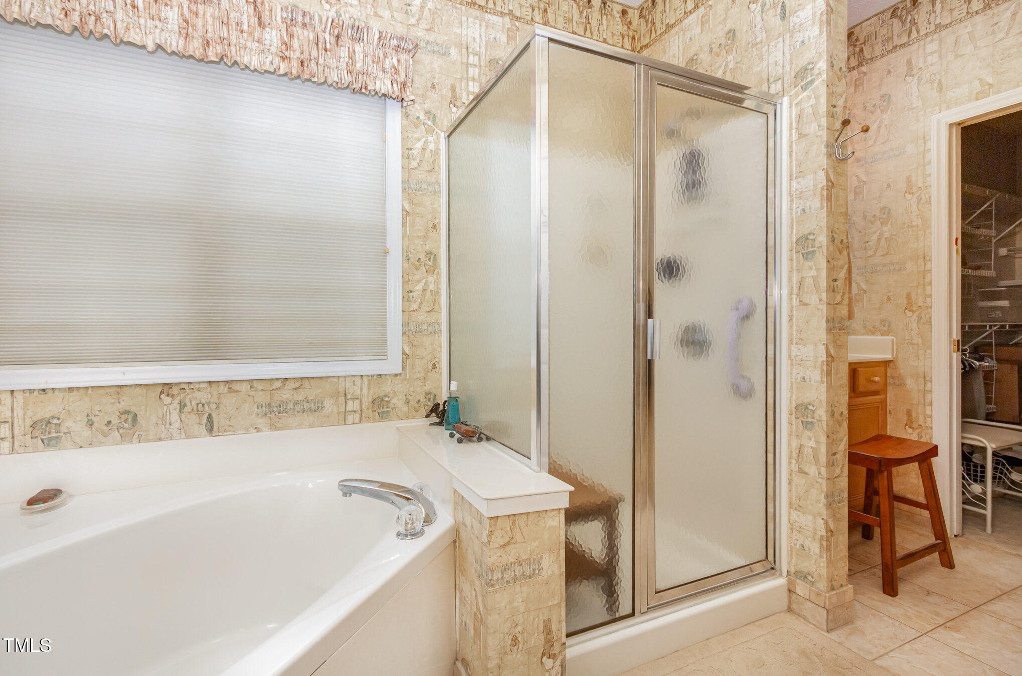 401 Stinhurst Drive Durham, NC 27713 - Photo 19 of 39 a bathroom with a tub and shower