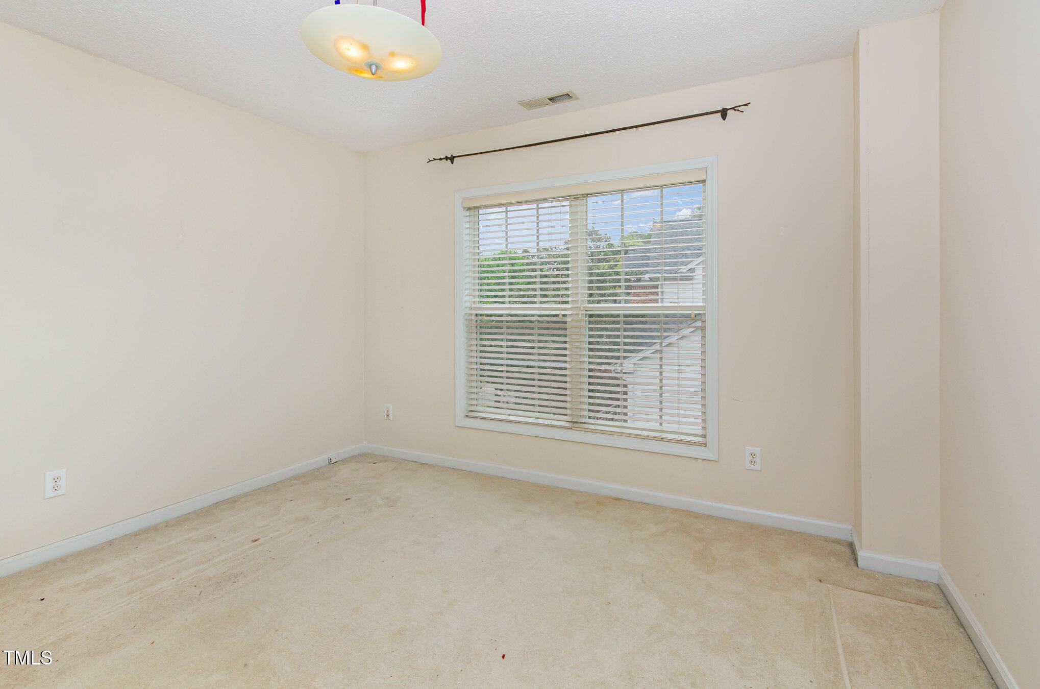 401 Stinhurst Drive Durham, NC 27713 - Photo 21 of 39 a view of an empty room with a window